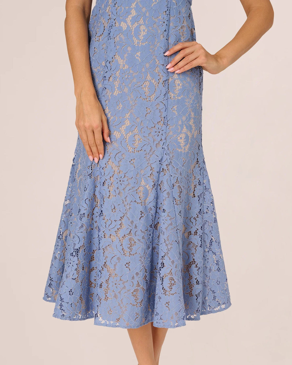 Blue lace midi A-line skirt with flared hem and allover floral lace overlay