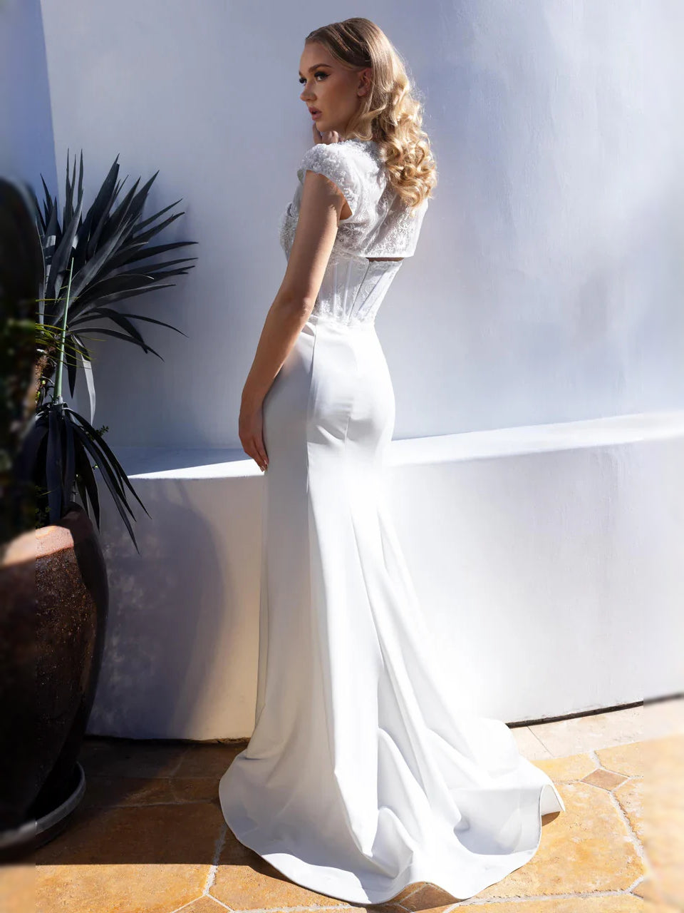 White sweetheart corset mermaid wedding dress with beaded lace bodice, floor-length