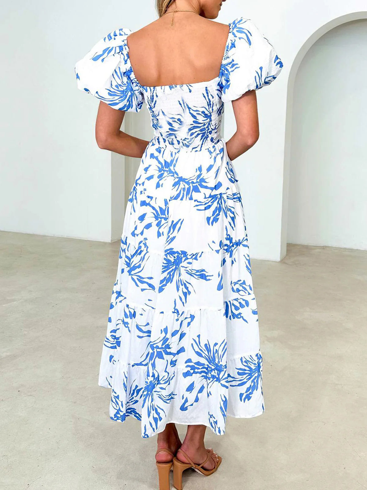 Blue-and-white floral midi dress with puff sleeves, square back, tiered skirt