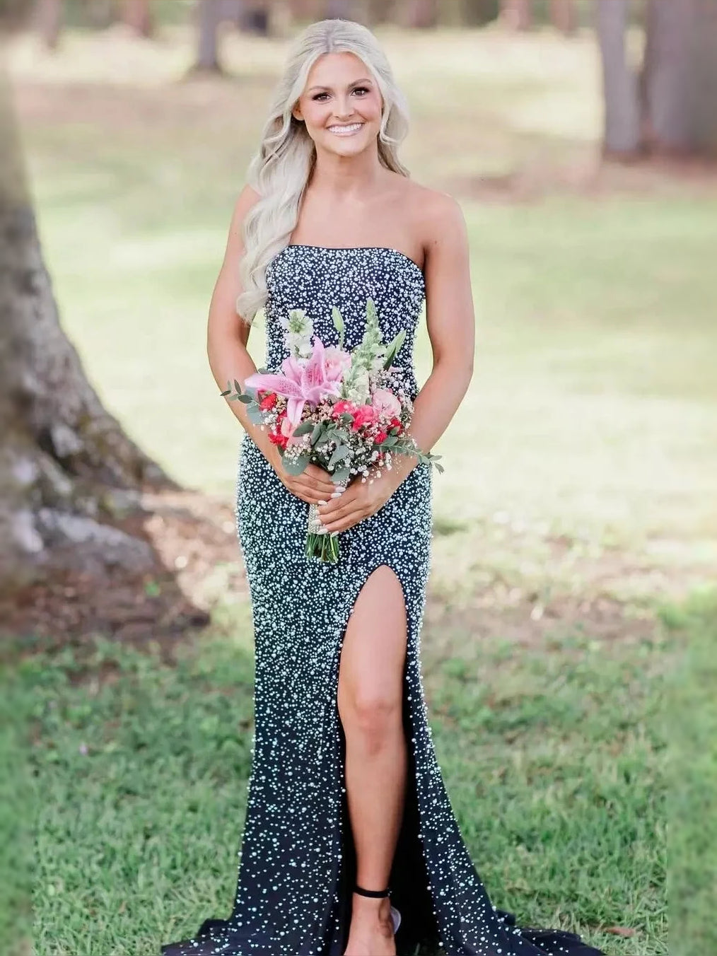 Black strapless beaded mermaid prom dress with corset bodice and front slit