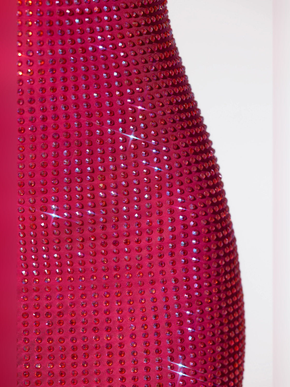 Hot pink sequin fabric with dense sparkle and shiny embedded stones