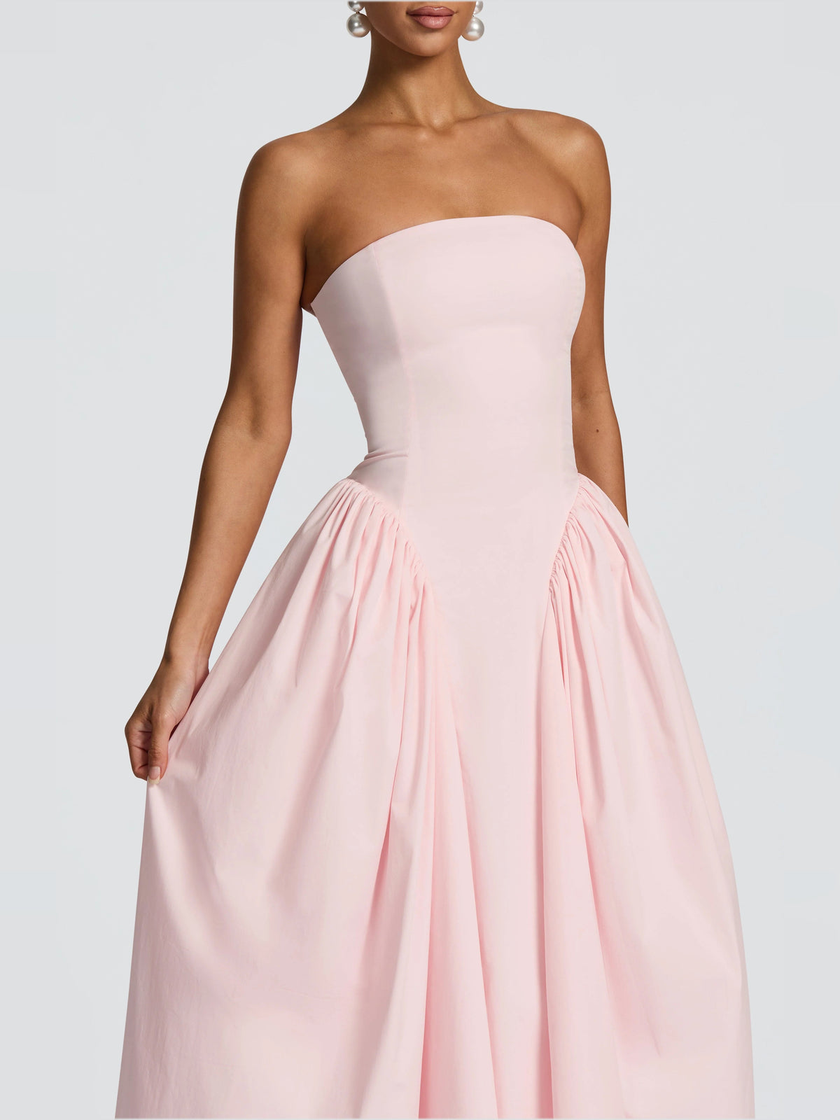 Blush strapless corset-style midi formal dress with pleated skirt