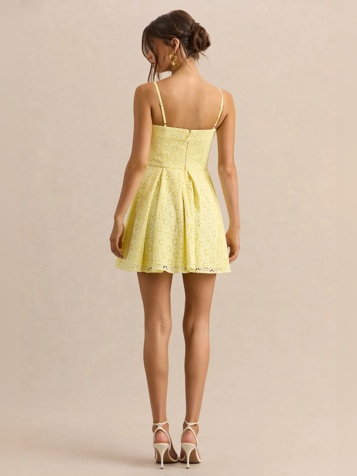Lemon yellow back-view mini dress with thin straps and pleated fit-and-flare silhouette