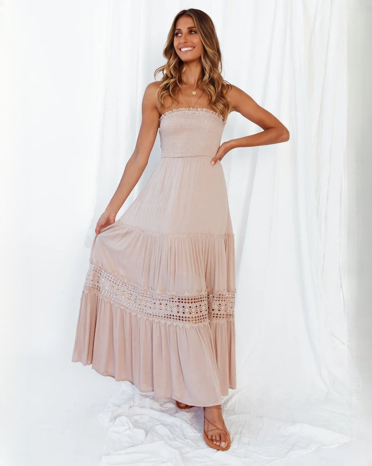 Blush pink tiered A-line maxi special occasion dress with lace-trimmed hemline