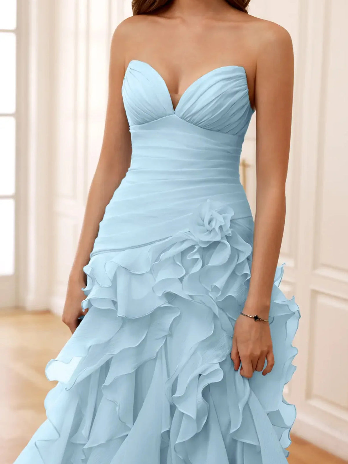 Sky-blue strapless formal dress with ruched bodice and layered ruffle skirt