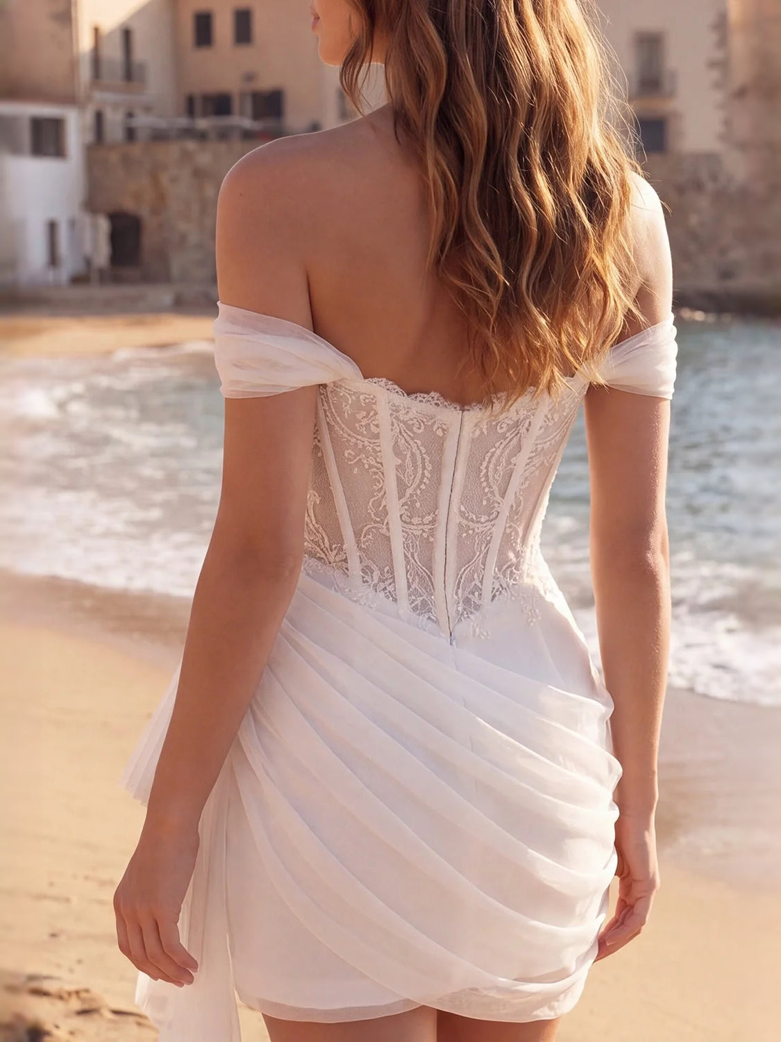 Ivory off-shoulder corset mini dress, lace back panel with draped tulle ruffle skirt