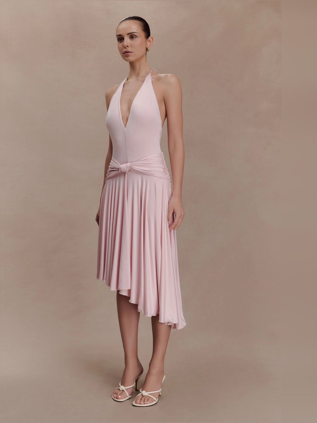 Pink asymmetric halter midi dress with pleated skirt and ruched waist detail