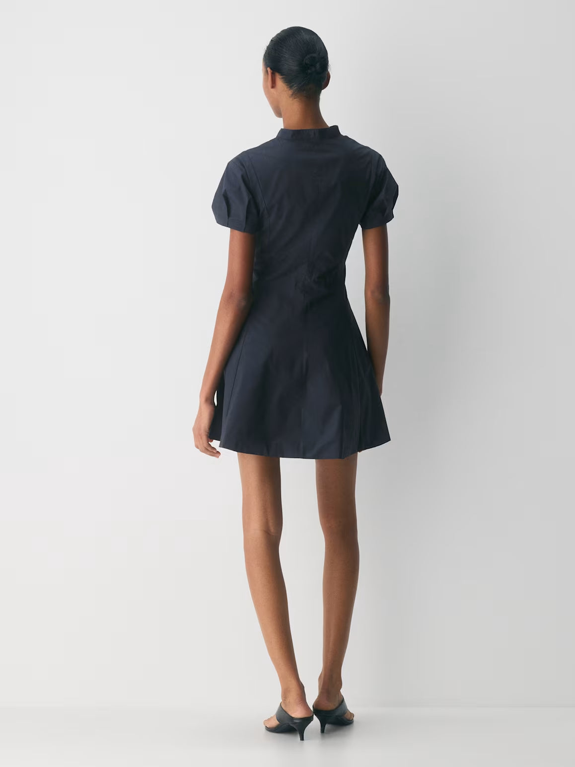 Dark navy A-line mini dress with short sleeves and high back, back view