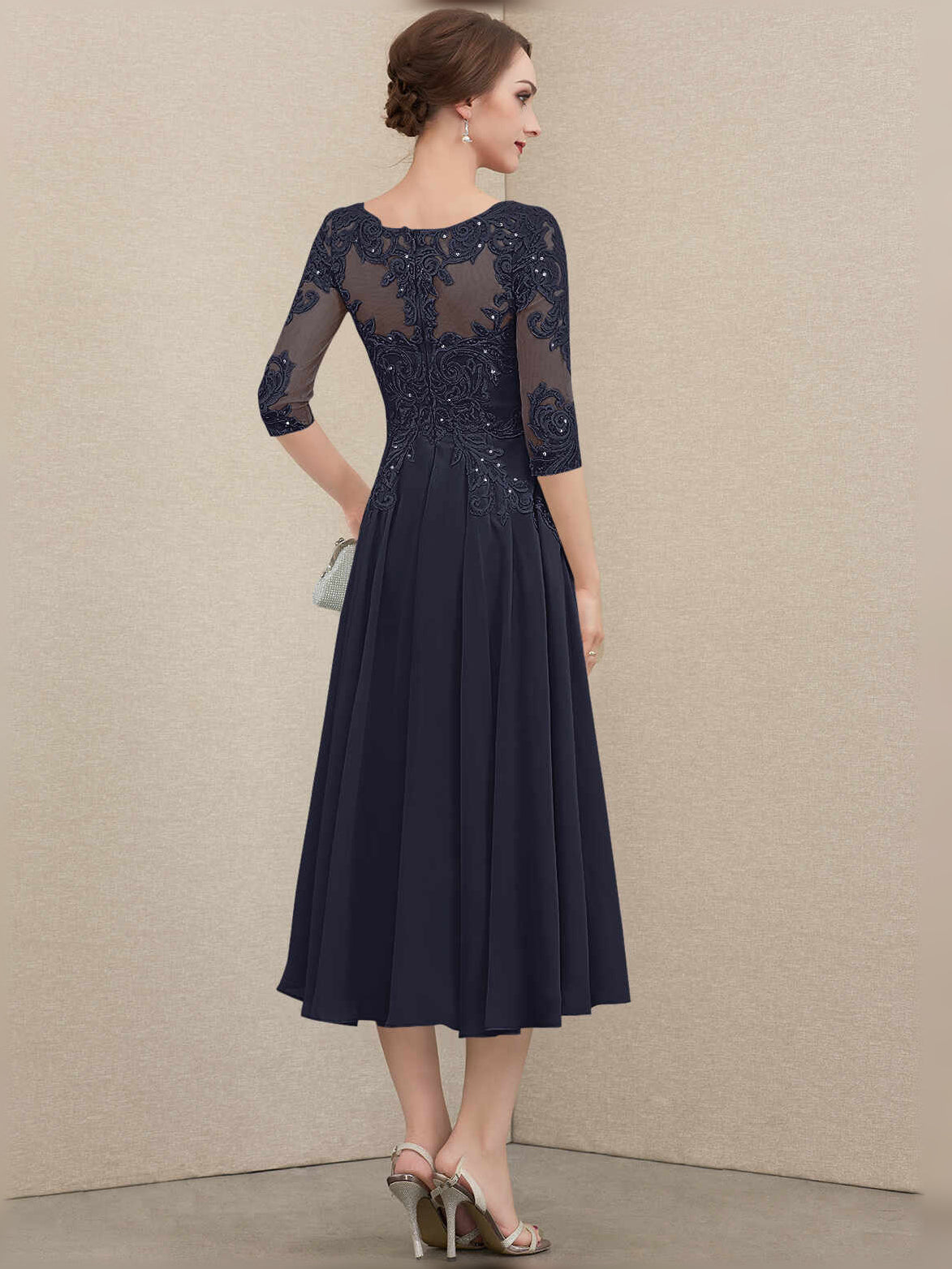 Navy pleated chiffon A-line mother-of-the-bride dress with embroidered illusion neckline