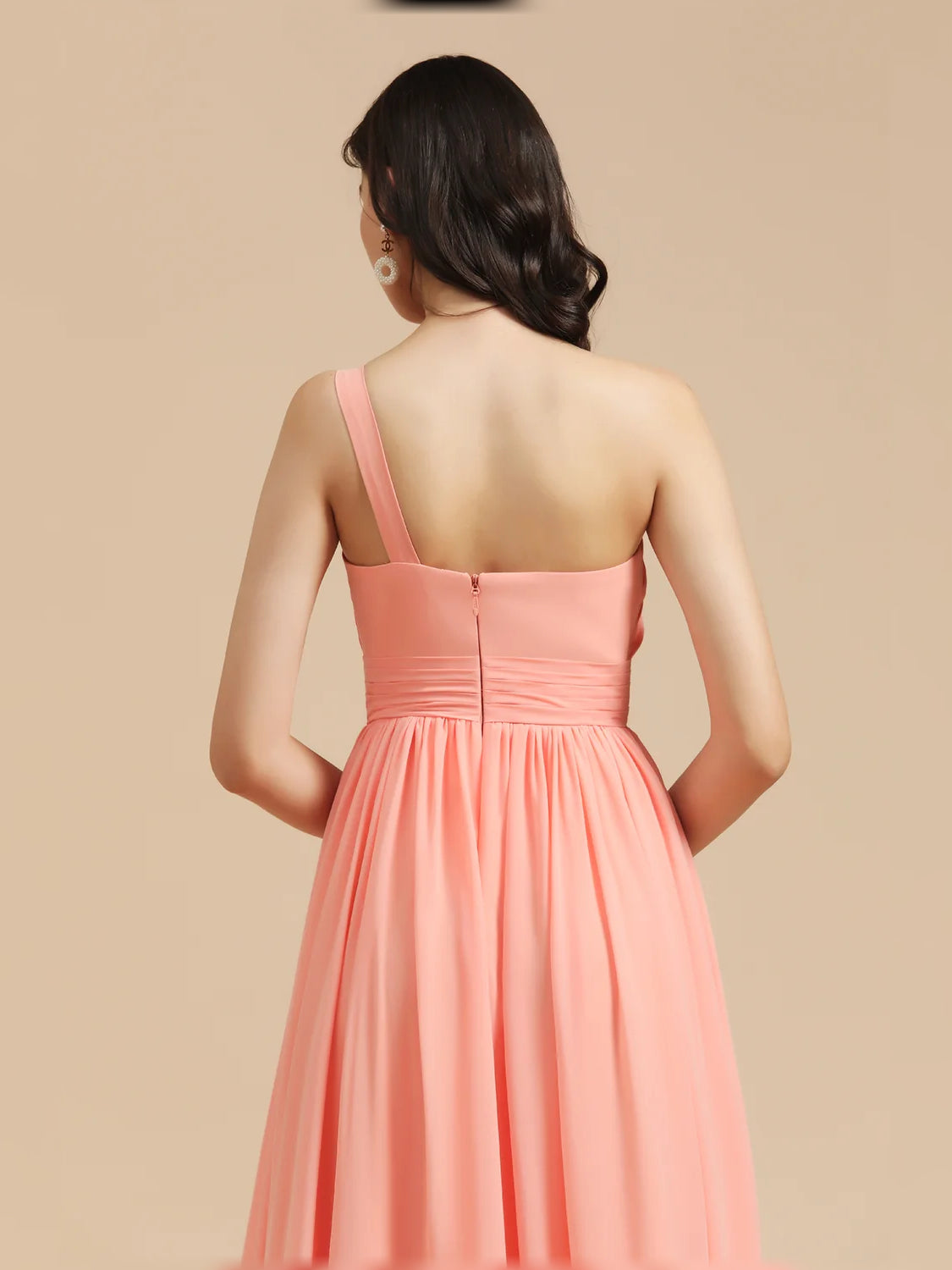 Coral one-shoulder pleated chiffon maxi dress with racerback straps, back view.