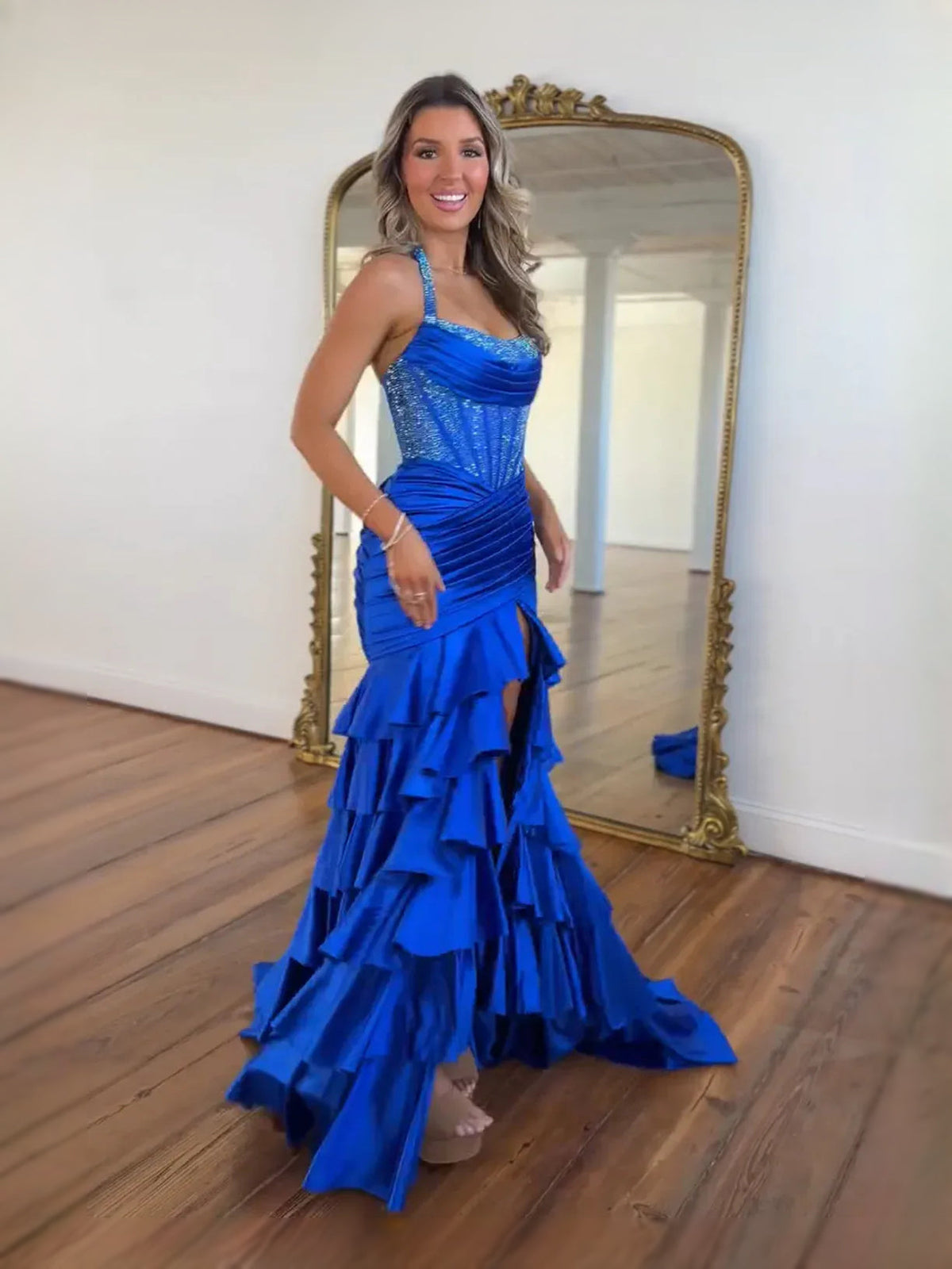 Cobalt blue satin halter mermaid prom dress with corset front and tiered ruffles