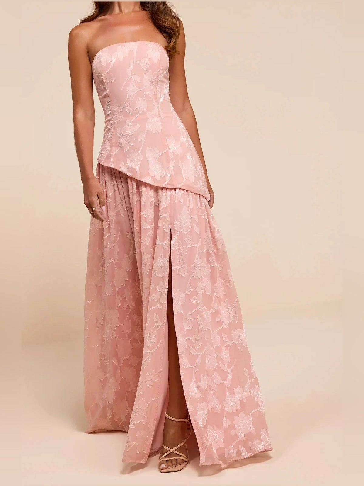 Dusty pink strapless A-line maxi dress with floral lace and center back slit
