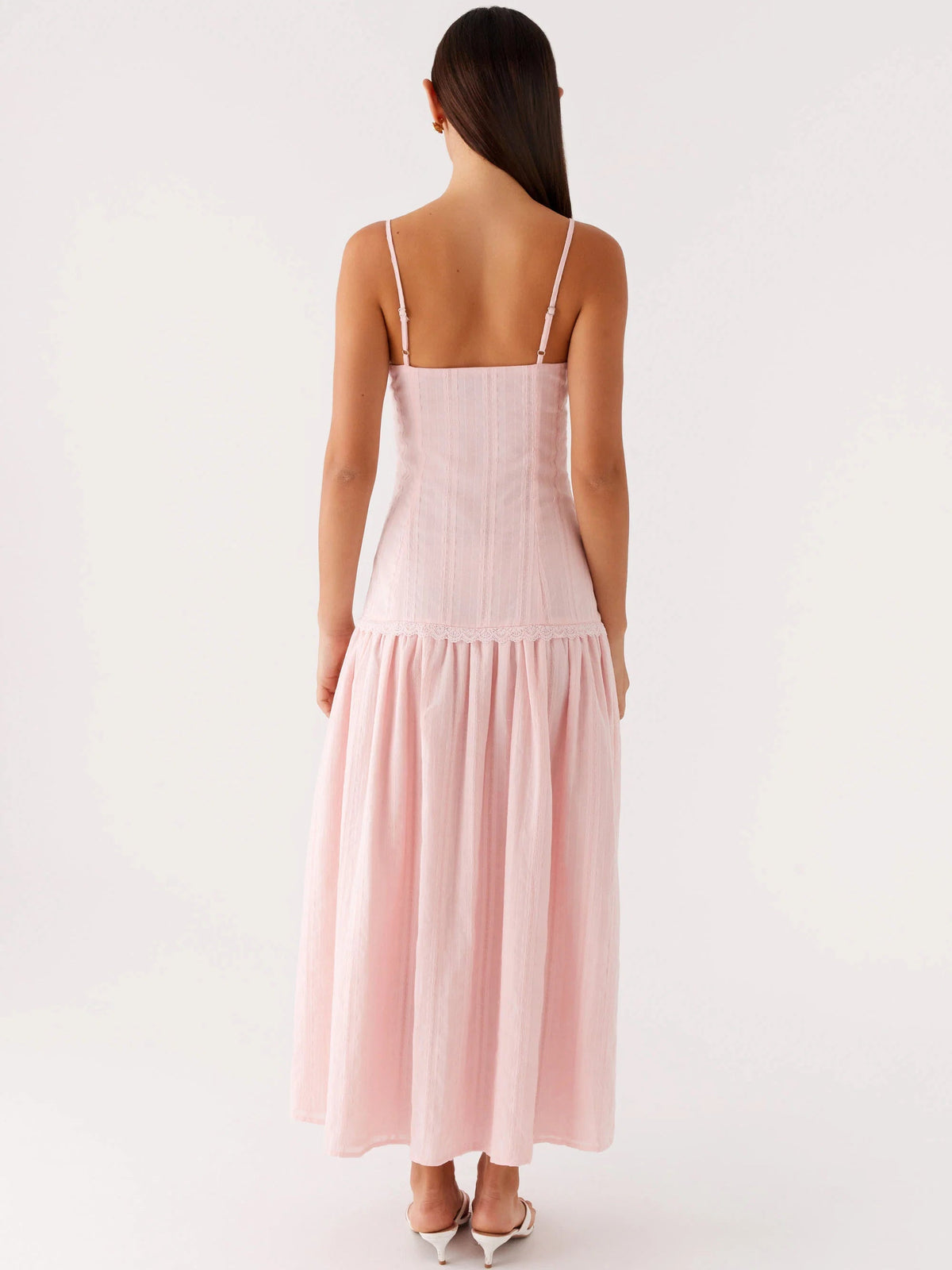 Pink midi formal dress back view with thin spaghetti straps and tiered skirt