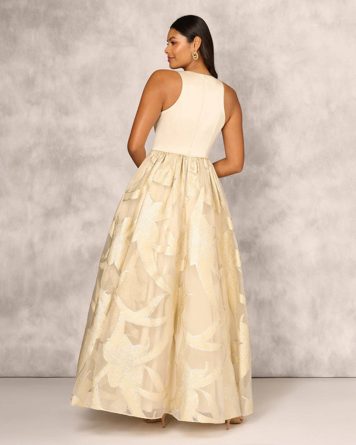 Gold sleeveless V-neck floor-length mother-of-the-bride dress with beaded skirt and draped appliques