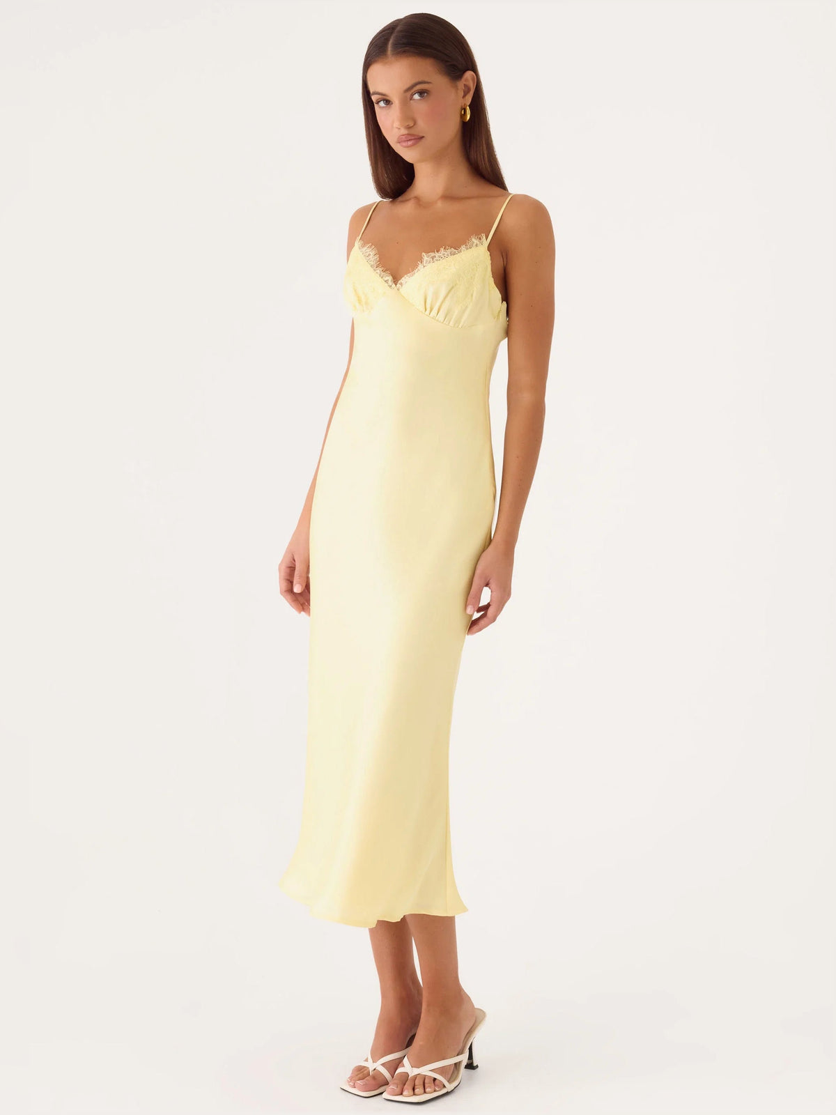 Yellow midi formal dress, angled front view, lace bodice and fitted silhouette