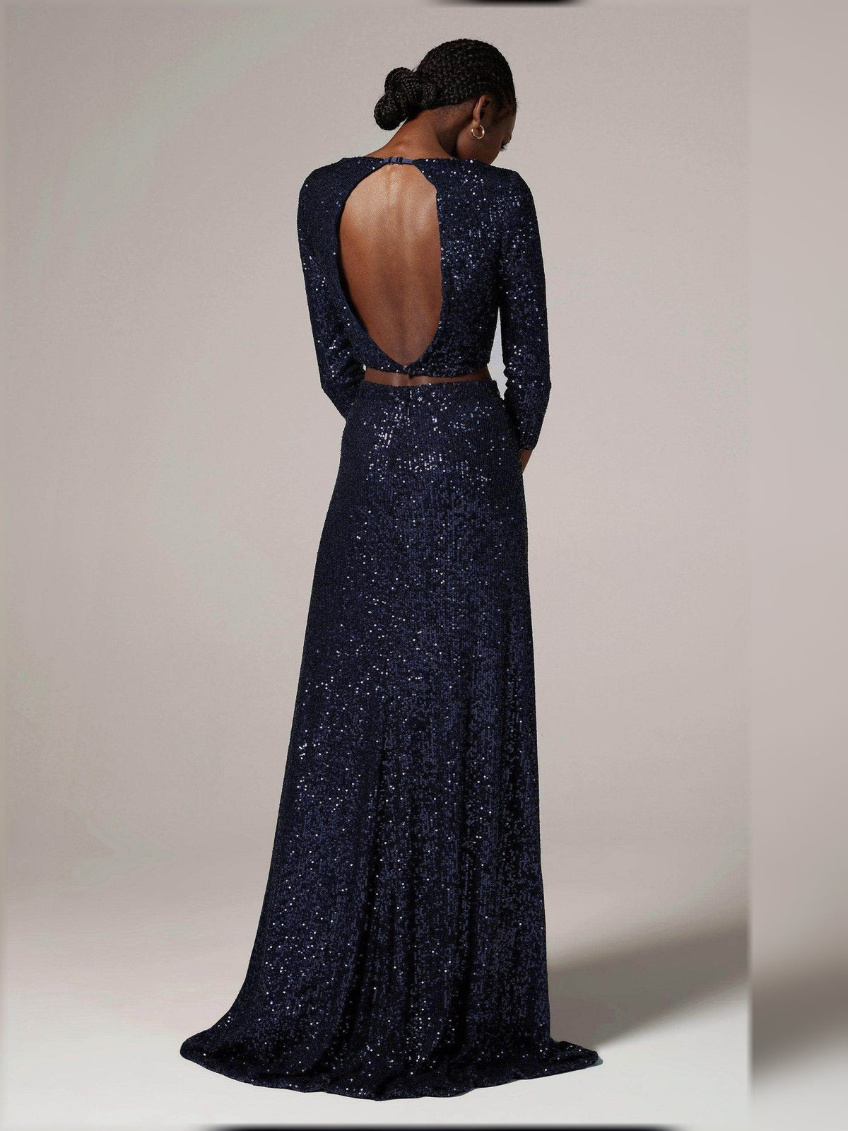 Dark navy sequin open-back formal dress with long sleeves and floor-length skirt