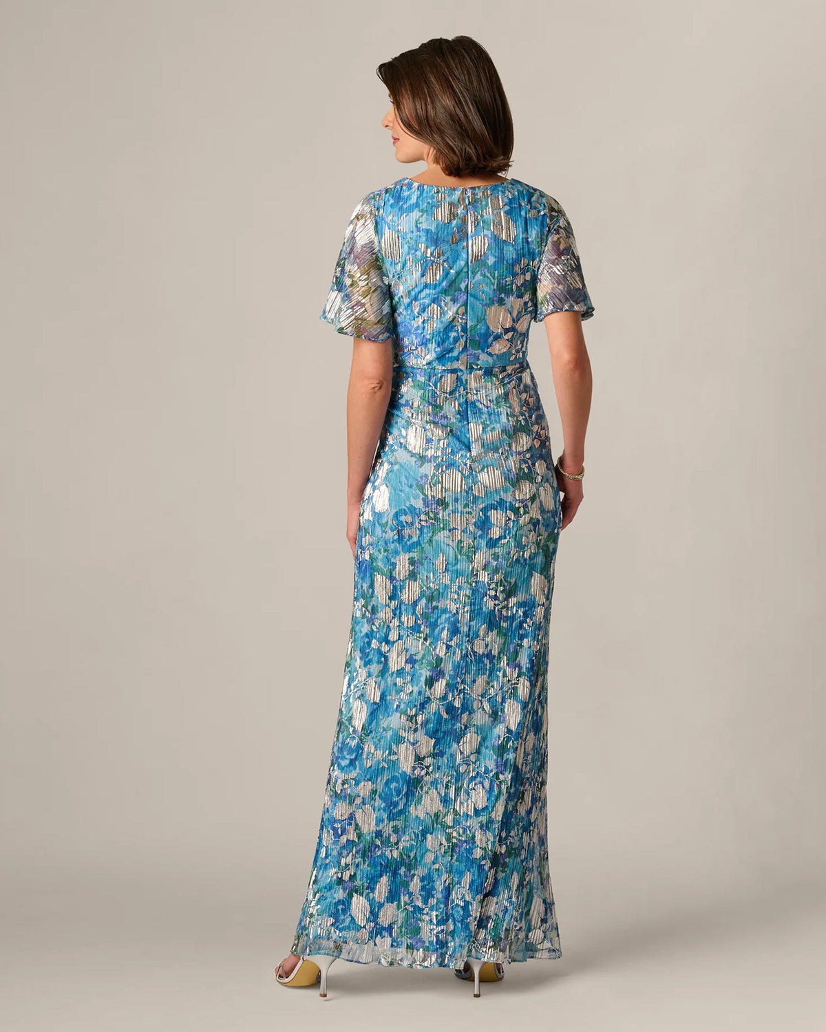 Blue floral print maxi dress back view with flutter sleeves and rounded back neckline