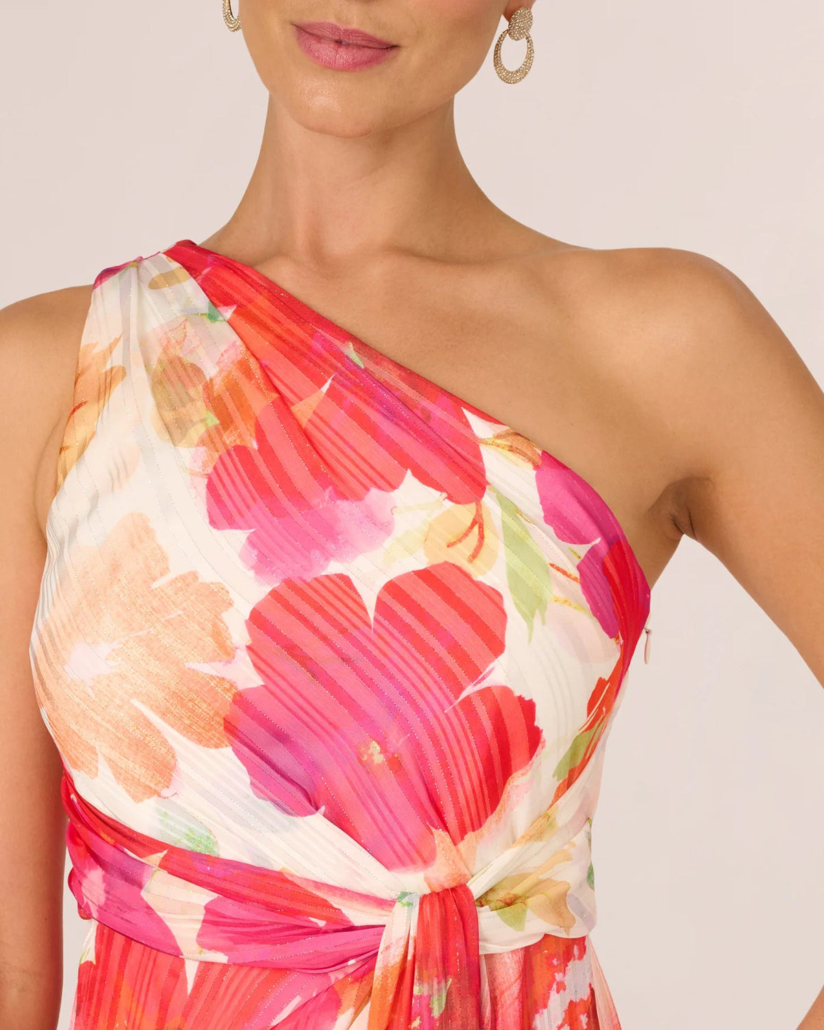 One-shoulder neckline detail, ivory base with pink/red floral blooms
