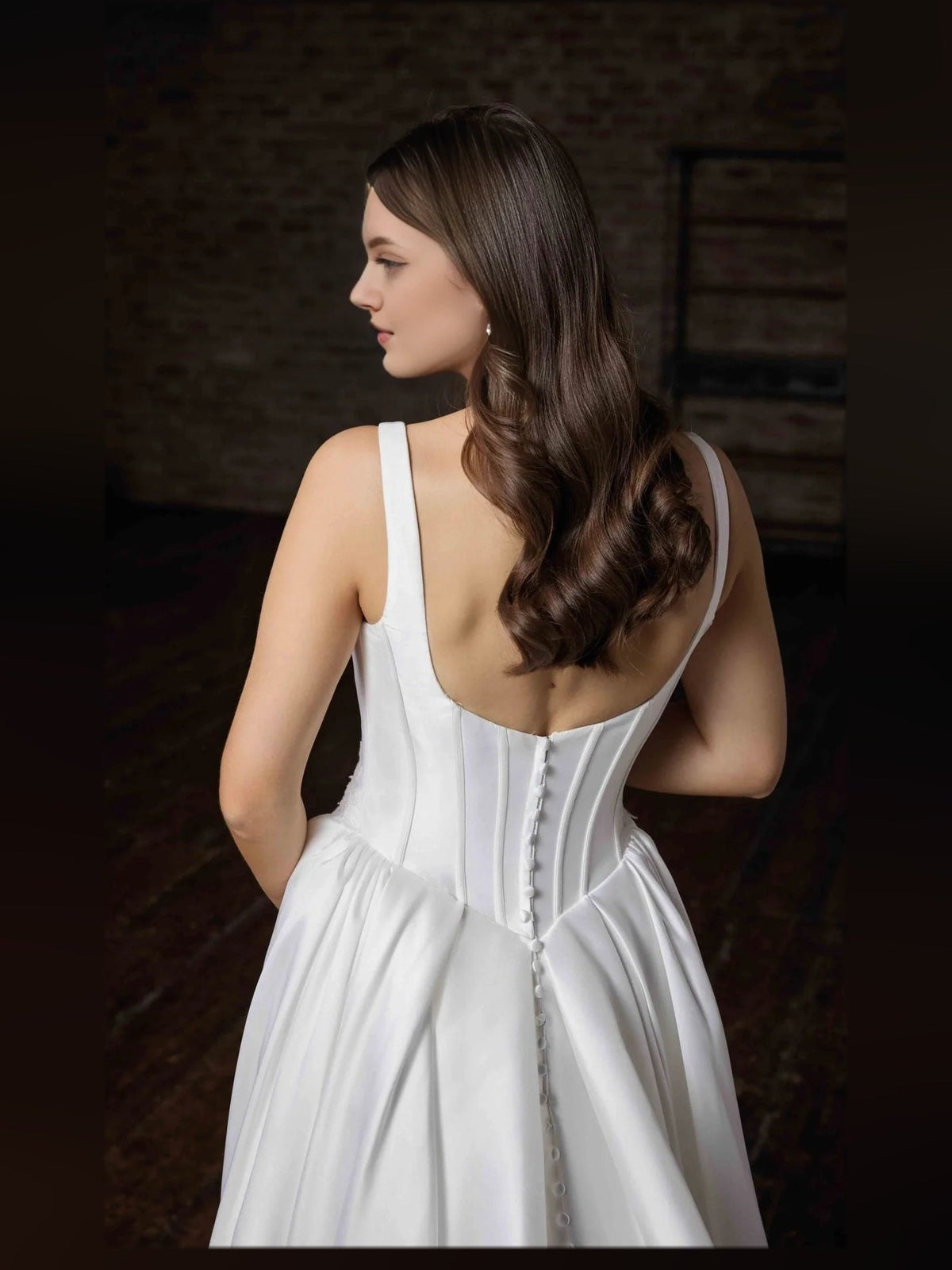 Ivory satin mermaid wedding dress with corset back and button detail