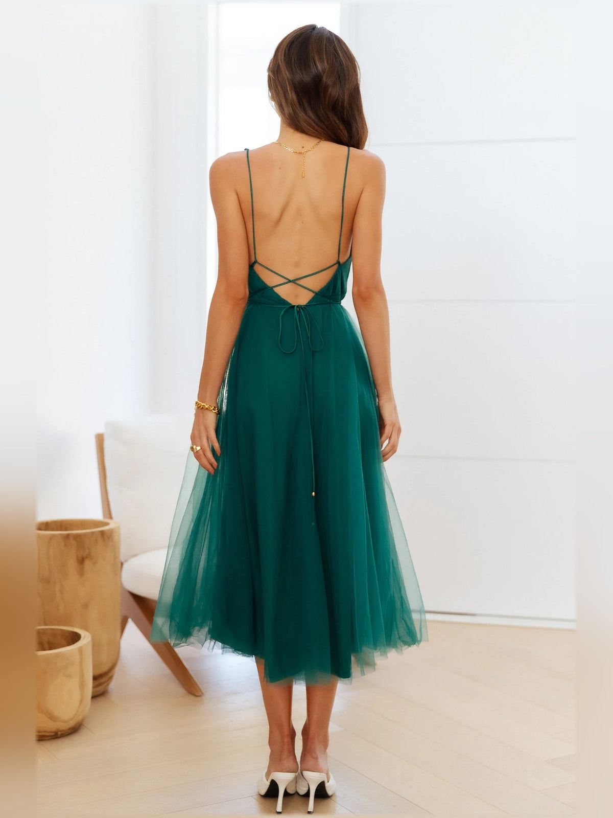 Forest green backless midi dress with crisscross straps and layered tulle skirt