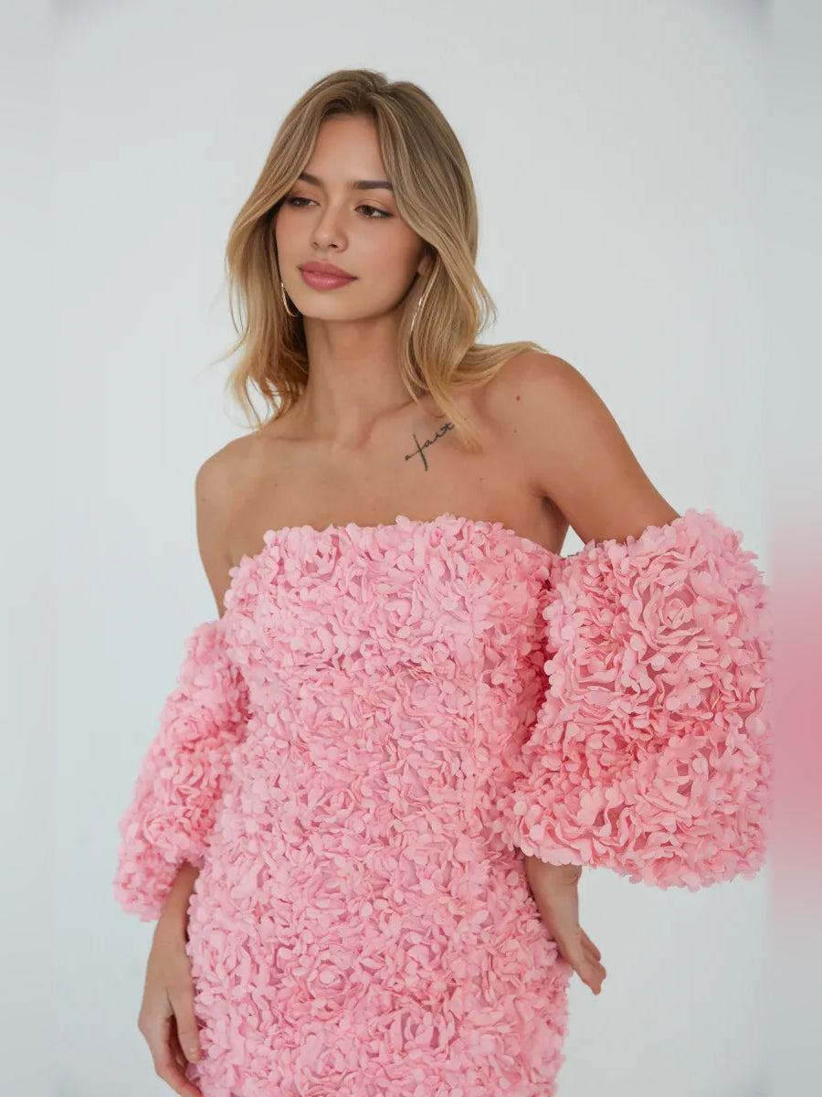 Light pink off-shoulder mini bodycon dress with dense floral ruffle detailing, close-up
