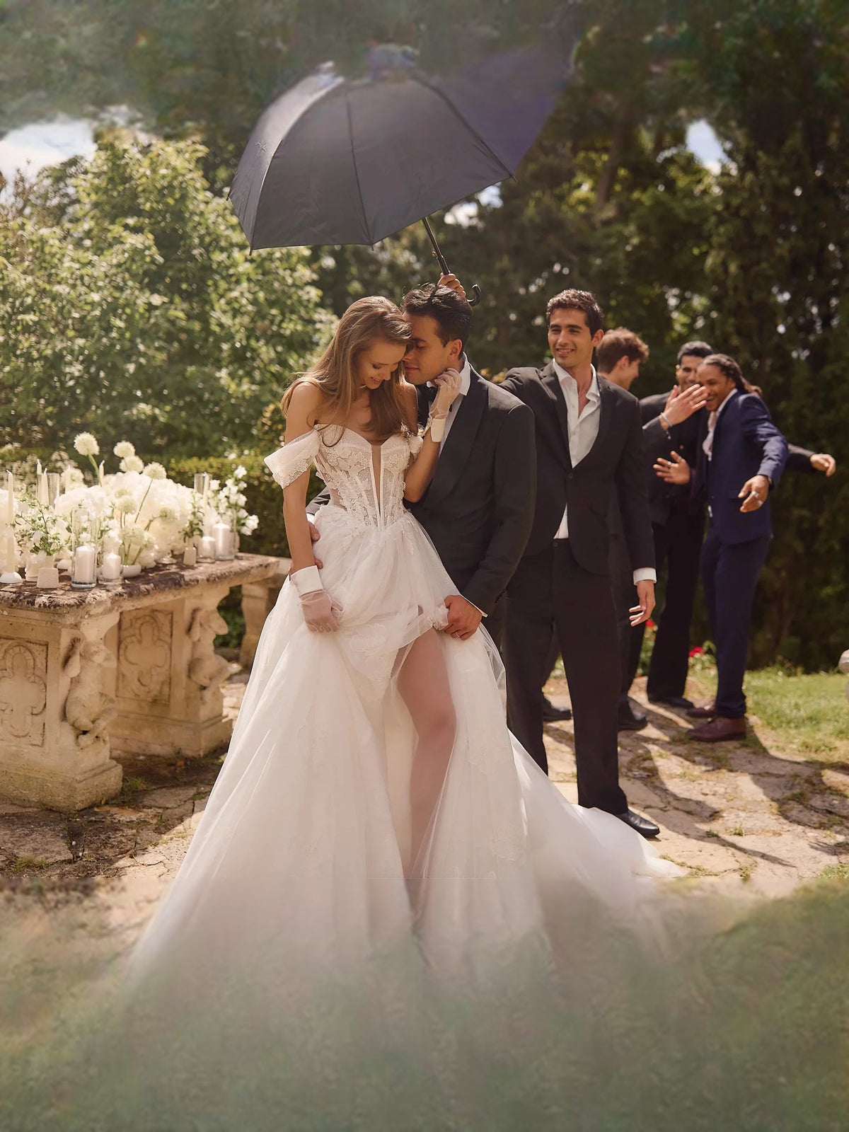 Ivory V-neck corset wedding dress with floral lace bodice and flowing tulle skirt