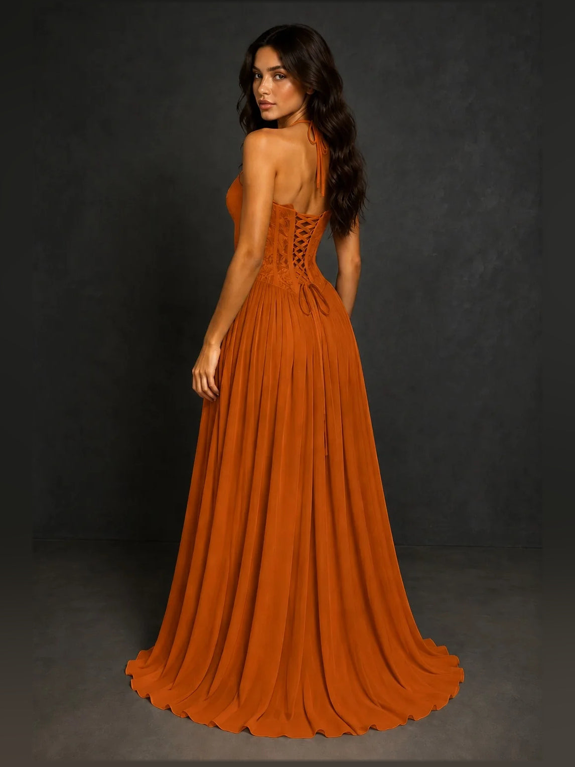Burnt orange sweetheart A-line prom dress with lace bodice and pleated floor-length skirt