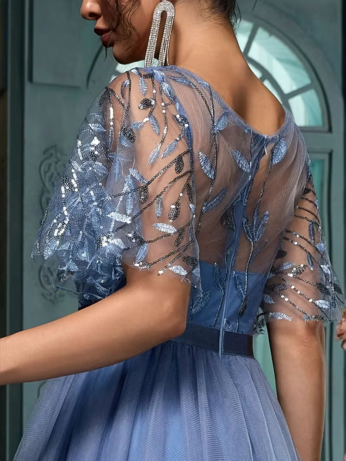 Slate blue sheer short-sleeve top with embroidered sequins over an A-line maxi prom dress bodice.