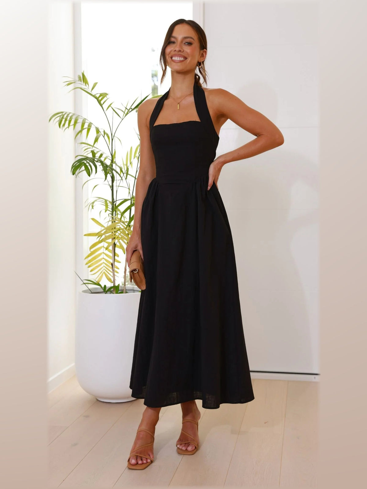 Black midi formal dress, alternate full-length view showing the hem