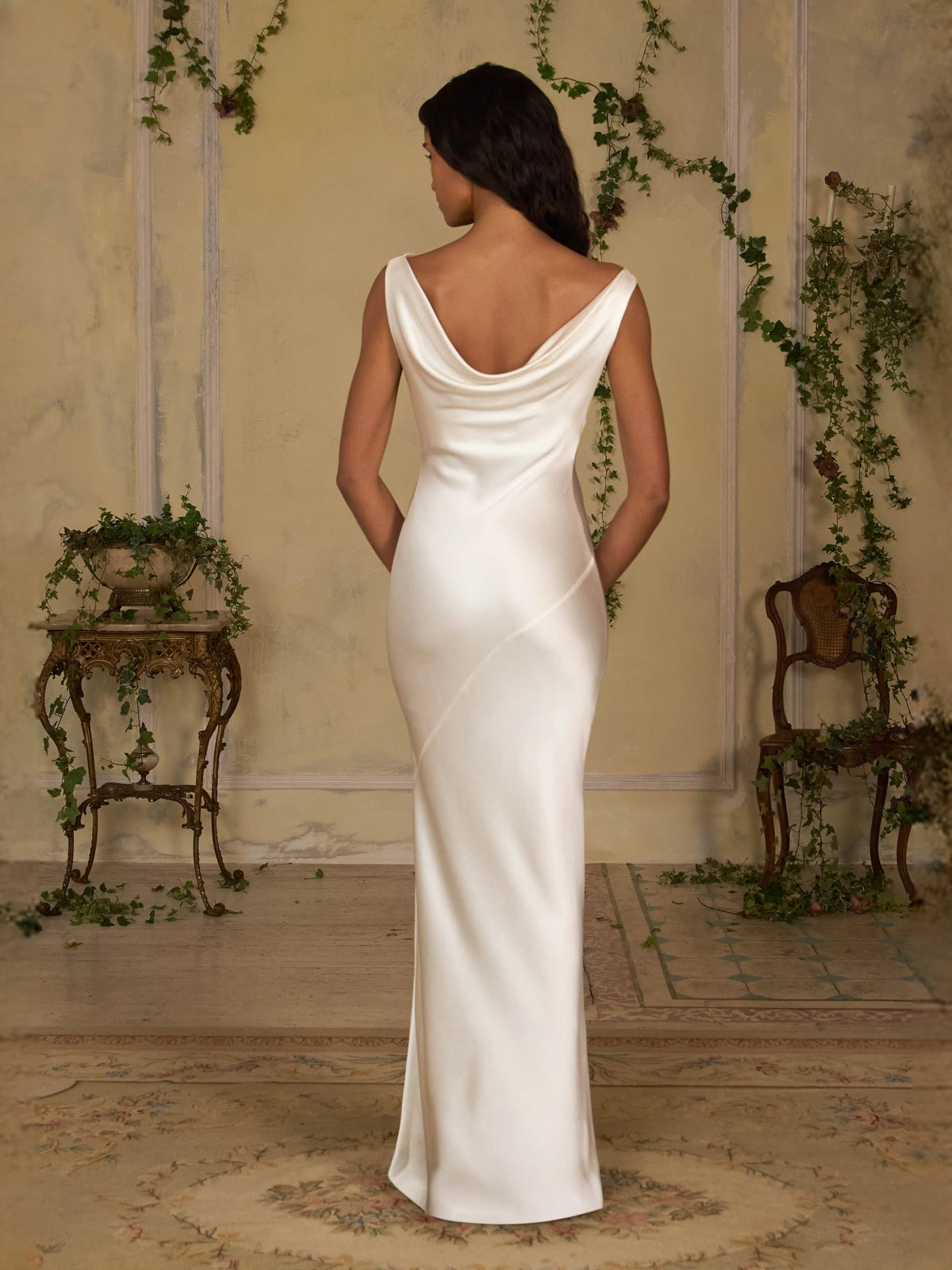 Ivory satin sheath maxi dress with cowl neckline, sleeveless, low open-back