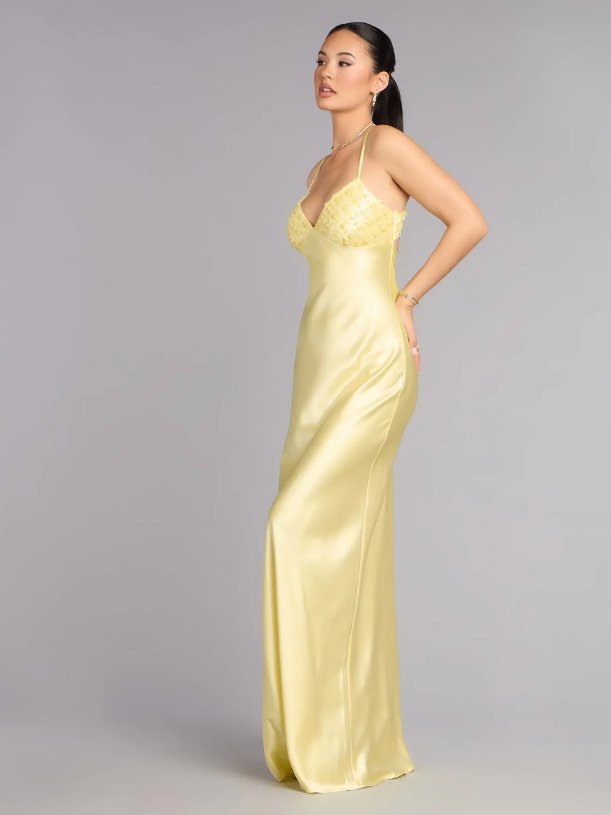 Yellow satin floor-length formal dress with beaded spaghetti straps and sweetheart neckline