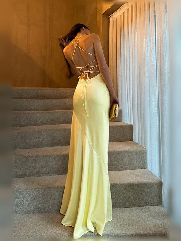 Pale yellow corset maxi dress with open back and crisscross lace-up straps