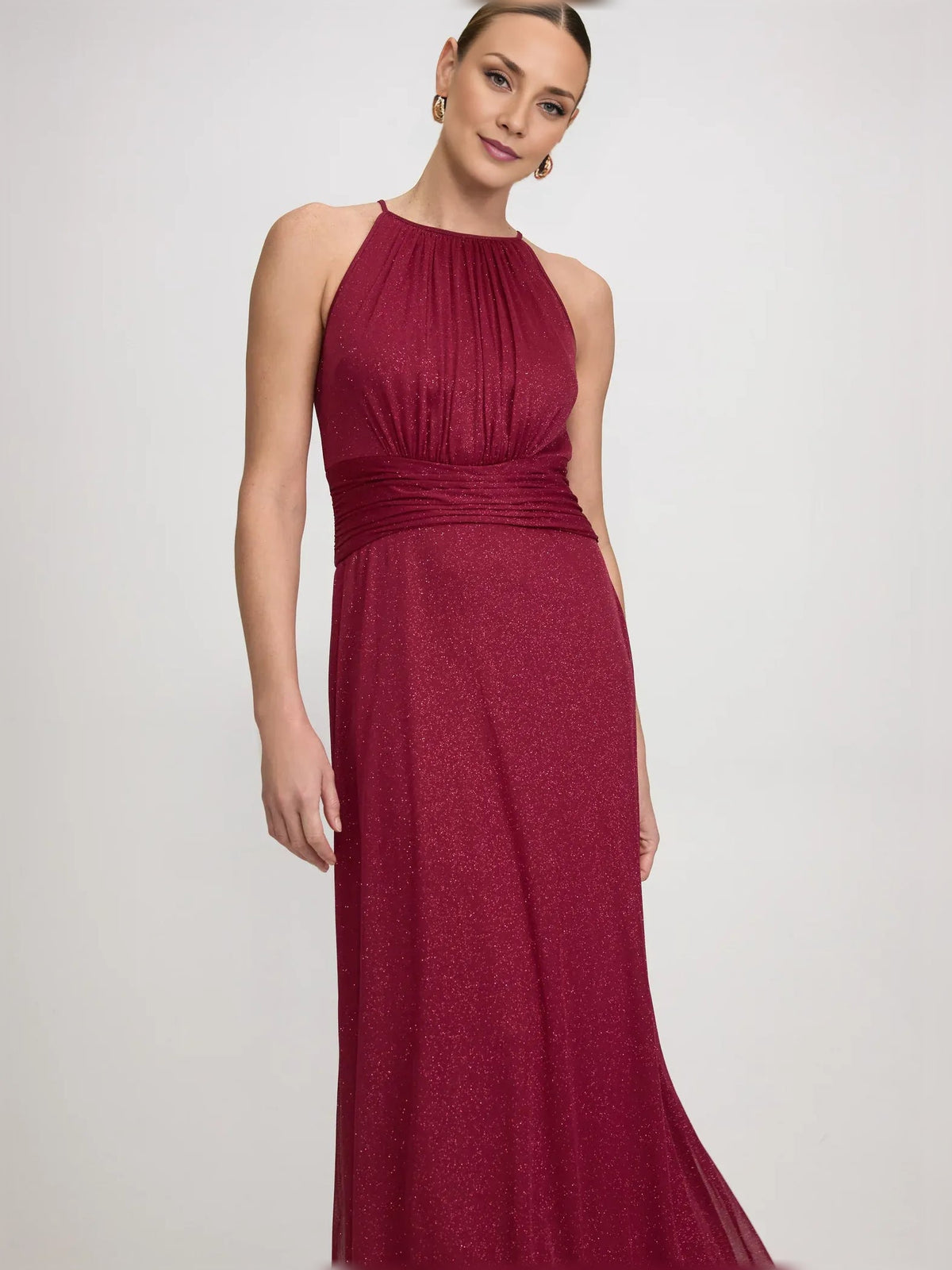 Burgundy halter-neck formal dress with ruched waist and flowing A-line skirt