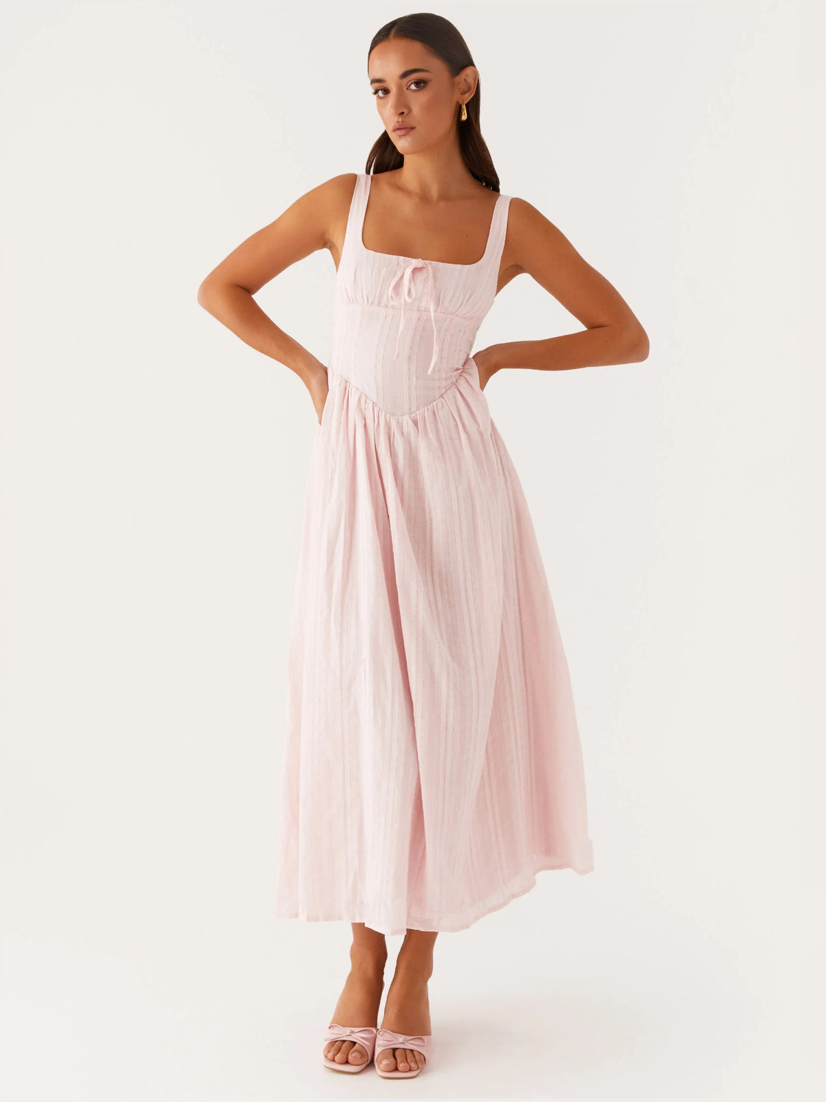 Pink midi formal dress with square neckline, smocked bodice, and tiered skirt