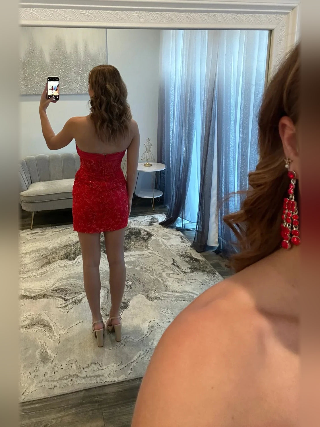 Red strapless mini dress, back view with textured lace and satin bow at sweetheart neckline