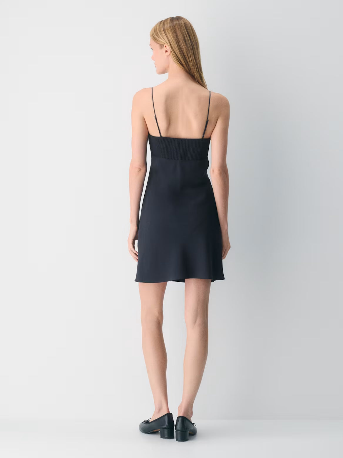 Navy mini crepe dress back view, spaghetti straps and short flared skirt