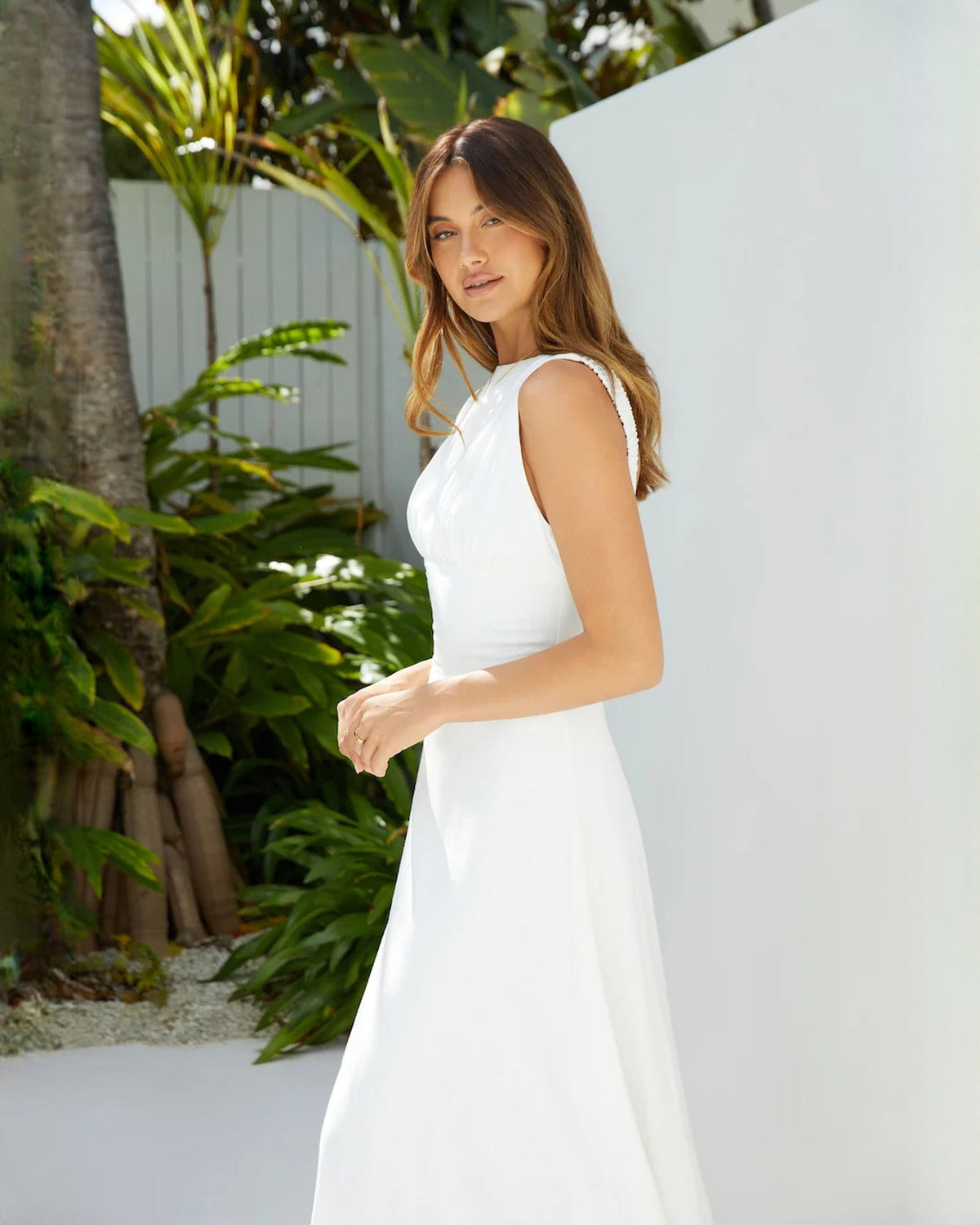 White sleeveless satin A-line maxi dress with sculpted waist seam
