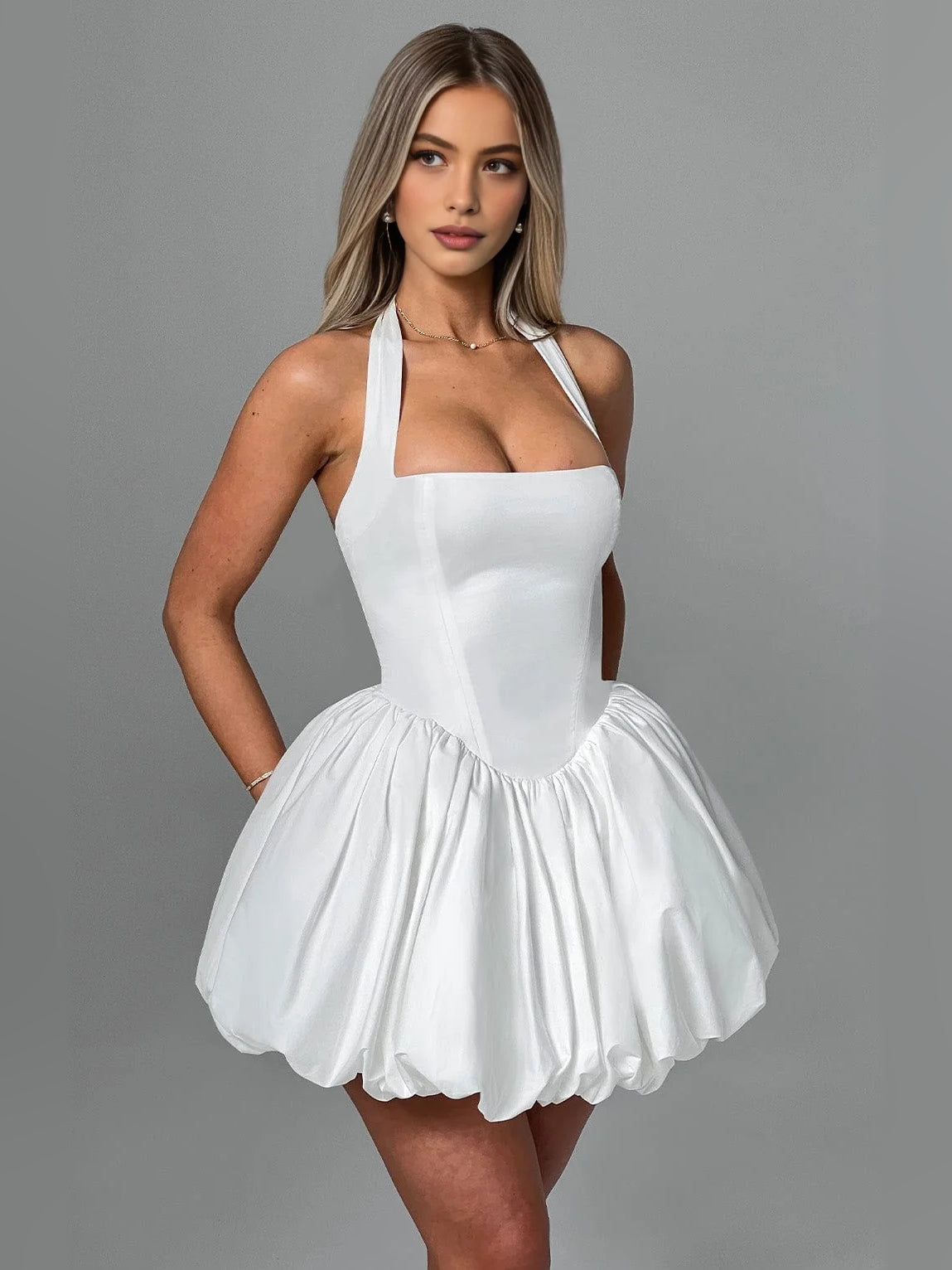 White corset halter mini dress with bow-tie straps and puffed fit-and-flare skirt