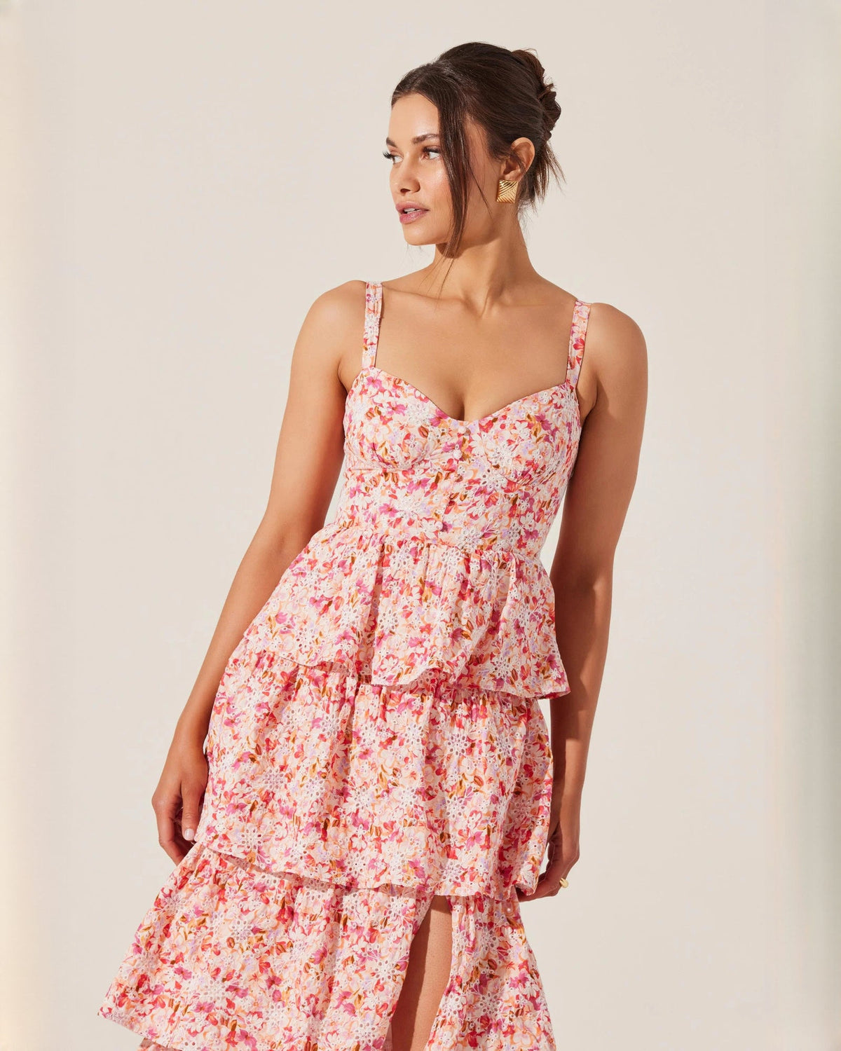 Pink floral chiffon maxi dress with V-neck bodice, gathered waist, and tiered ruffles