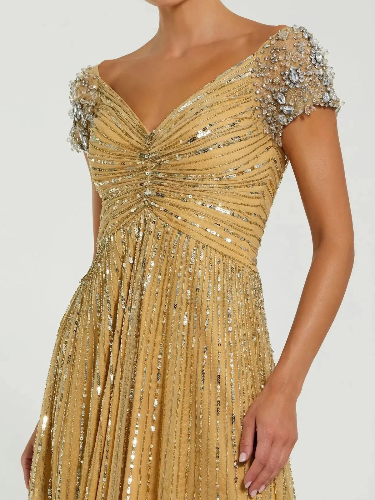 Gold formal dress with sweetheart neckline and draped beaded cap sleeves