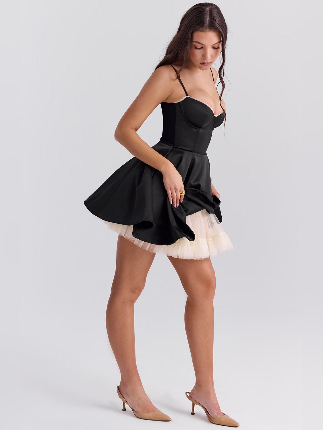 Black mini dress with corset-style bodice, spaghetti straps, and fluffy layered tulle hem