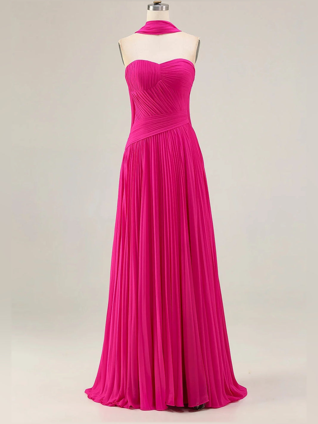 Fuchsia strapless sweetheart A-line maxi dress on mannequin, pleated chiffon