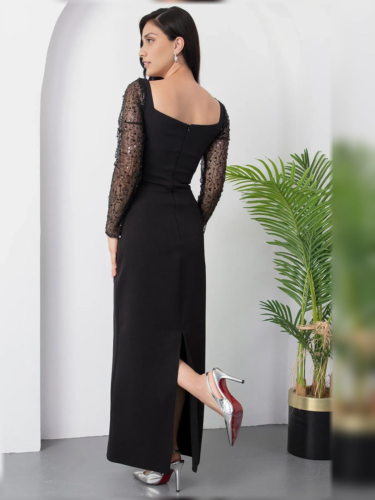 Black square-neck formal dress with sheer sequin long sleeves and side slit, floor-length