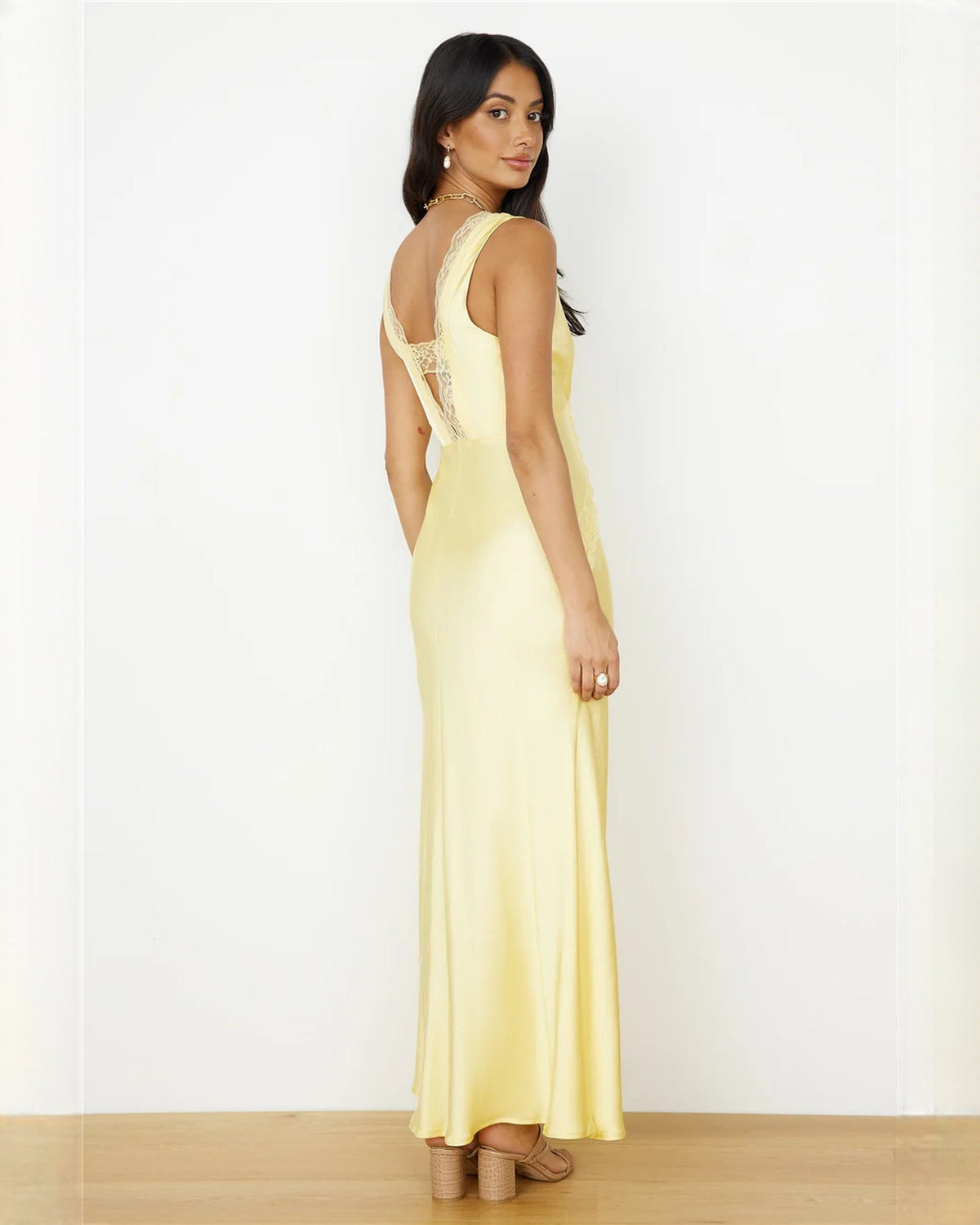 Light yellow satin A-line maxi dress, sleeveless lace neckline and flowing side silhouette
