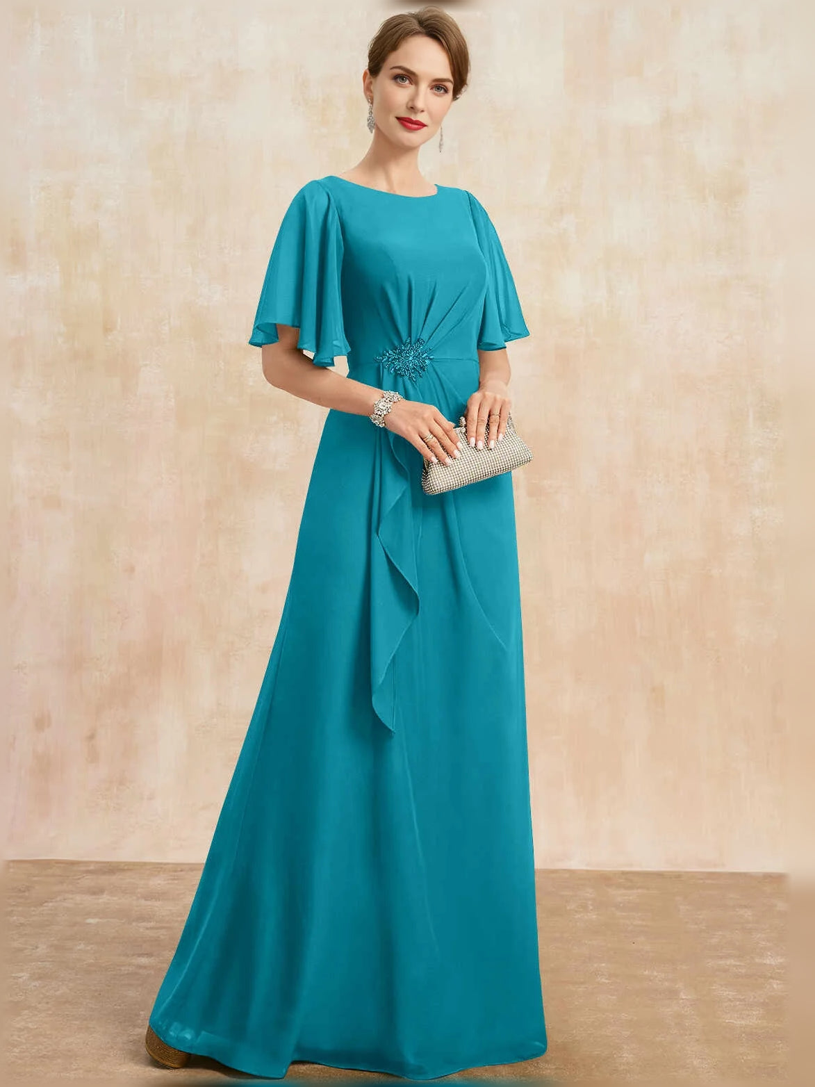 Teal floor-length draped sheath dress with short flutter sleeves and embellished waist