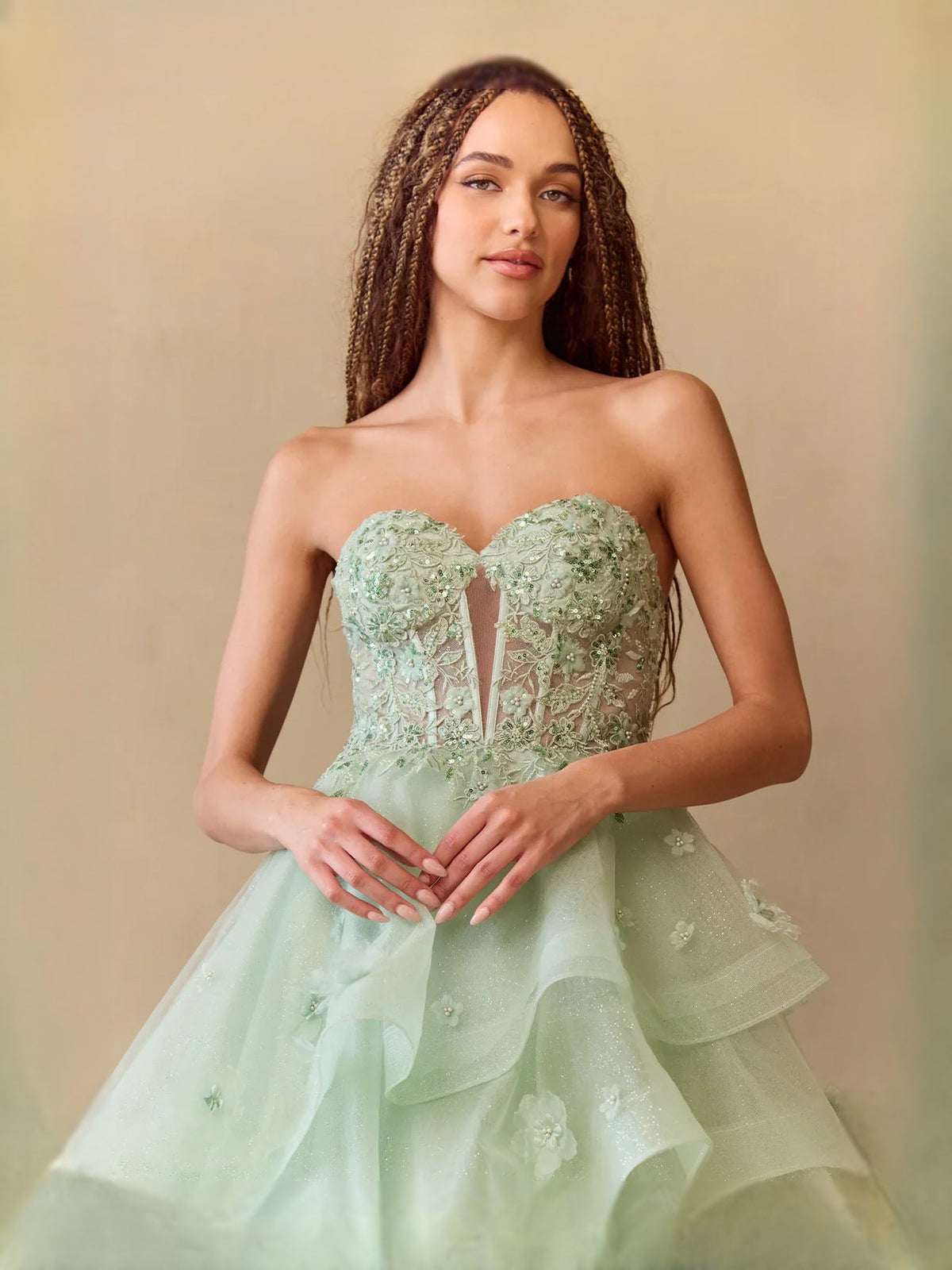 Sage green strapless sweetheart prom dress with layered tulle ruffle skirt, floral detail