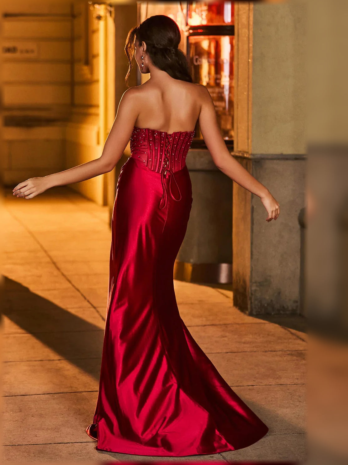 Burgundy sweetheart corset slit formal dress with back view and floor-length drape