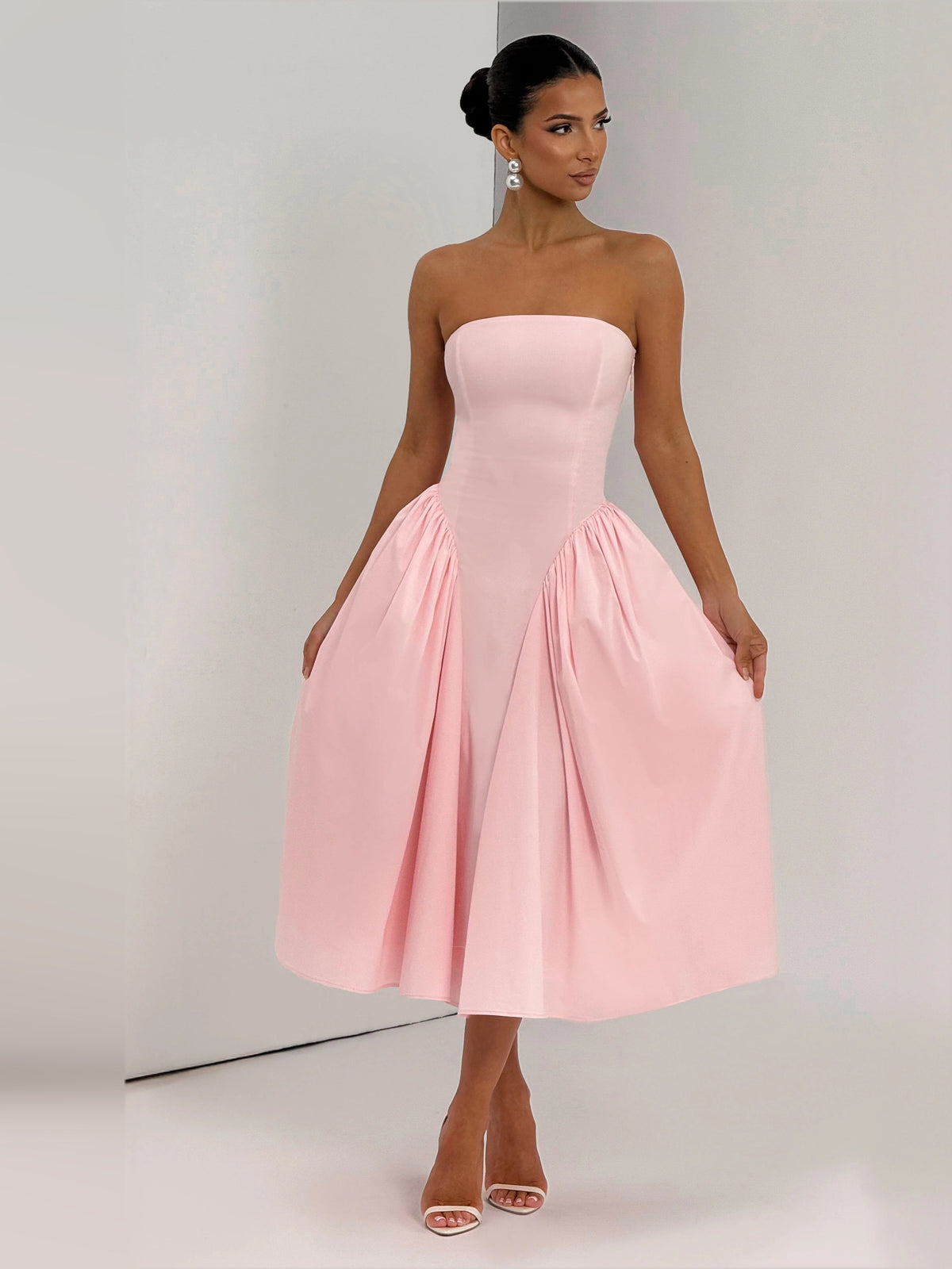Blush strapless midi formal dress with gathered waist and flared pleated skirt
