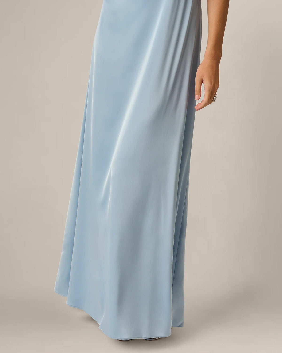 Powder blue A-line maxi skirt with draped waist and smooth flowing fabric