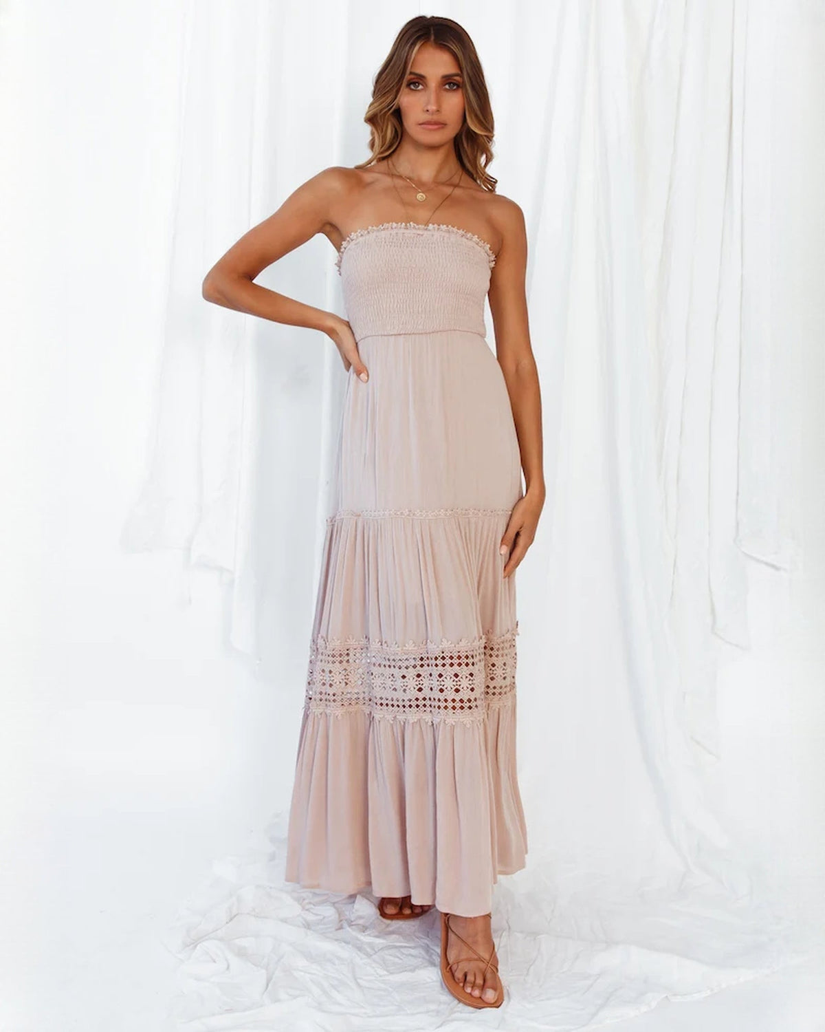 Blush pink smocked bodice maxi dress with tiered skirt and crochet lace border